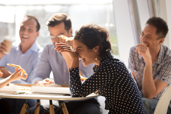 A team of professionals all sharing a laugh together